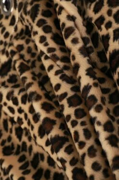 PRE-ORDER: Peekaboo Fuzzy Leopard Print Grommet Mini Skirt -TUNNEL Vision Shop 611A2076